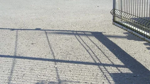 Security Gate casts Shadow Stock Footage 49580797