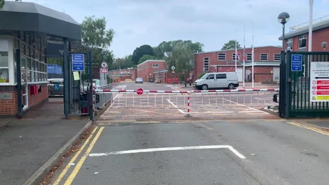 Security gate entrance with a barrier at the entry of a business building Stock Footage 250740215