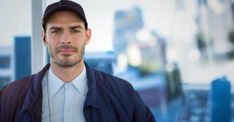 Security guard against blurry window showing city Stock Photos