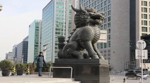 Security guard and Chinese dragon outside a bank Stock Footage 35011392
