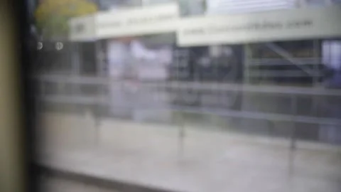 Security guard being reflected on streetcar window Stock Footage 153888601