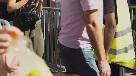 The security guard at the checkpoint by the detector checks people 스톡 동영상 90490684