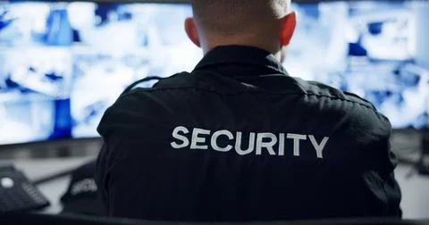 Security guard, computer screen and watch by cctv monitor for protection, data Stock Photos
