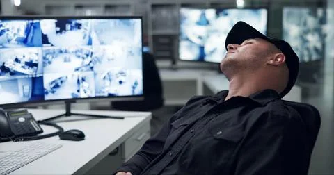 Security guard, computer screen and tired by cctv monitor for protection, data Foto stock