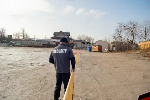 Security guard conducting access control and traffic control Stock Photos