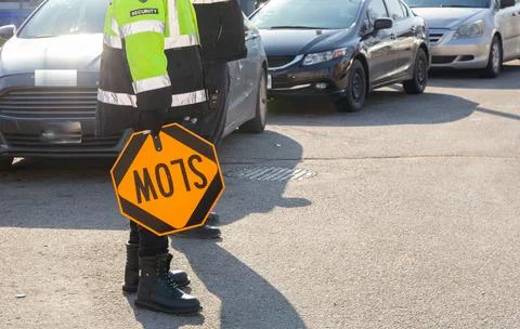Security guard conducting access control and traffic control Stock Photos
