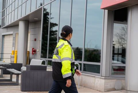 Security guard conducting access control and traffic control Stock Photos