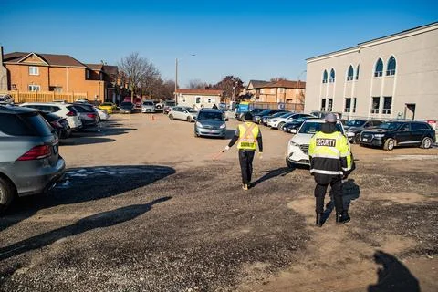 Security guard conducting access control and traffic control Stock Photos