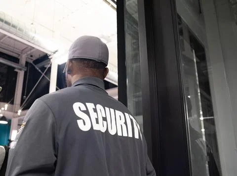 Security guard conducting access control and traffic control 스톡 사진