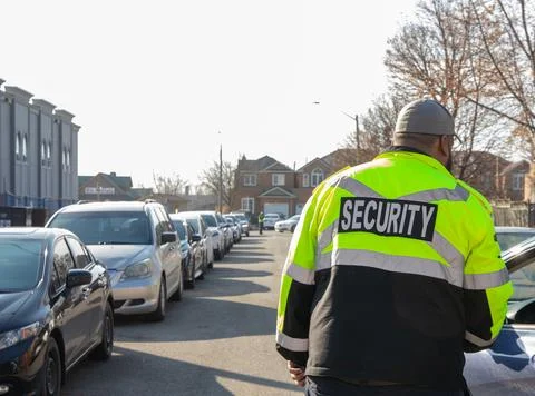 Security guard conducting access control and traffic control 스톡 사진