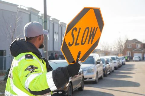 Security guard conducting access control and traffic control 스톡 사진