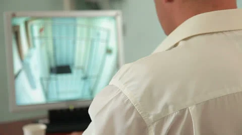 Security guard in control room at CCTV Stock Footage