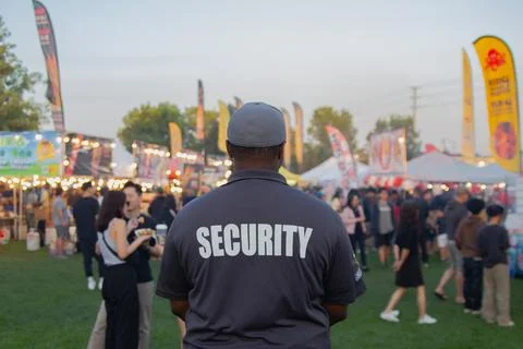 Security guard controlling the traffic and parking at Asian festival in Canada Stock Photos