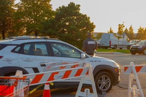 Security guard controlling the traffic and parking at Asian festival in Canada Stock Photos