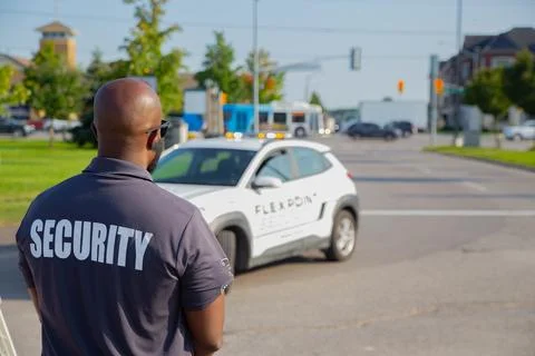 Security guard controlling the traffic and parking at Asian festival in Canada Stock Photos