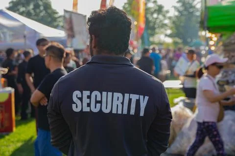 Security guard controlling the traffic and parking at Asian festival in Canada Stock Photos