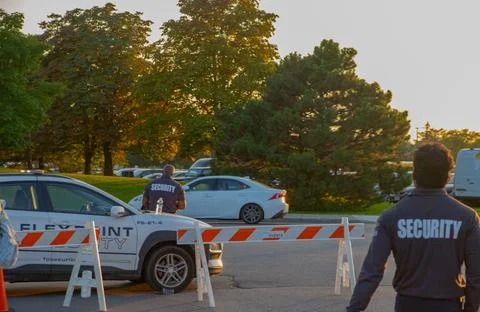 Security guard controlling the traffic and parking at Asian festival in Canada Stock Photos