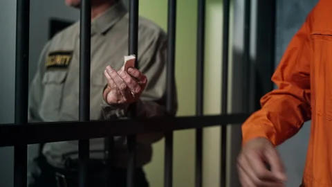 Security guard delivering narcotics to inmate, drug trafficking in prison Stock-Footage 319009420