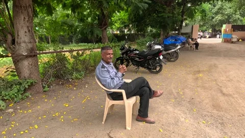 Security guard is doing security outside the garden Stock Footage 247766724