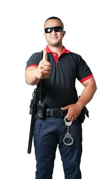 A security guard dressed in black, wearing black glasses, stands up straight  Foto stock