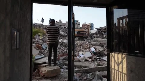 Security guard found alive at collapsed Sol Marino Garden building in La Guaira, Stock Footage 337929264