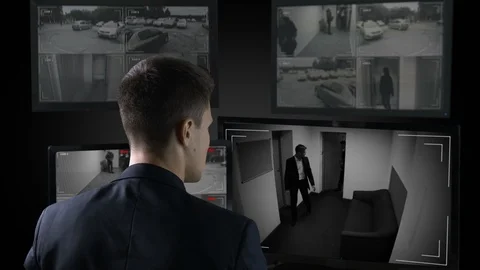Security guard looking in corporative surveillance cameras, crime scene witness 스톡 동영상 109187748