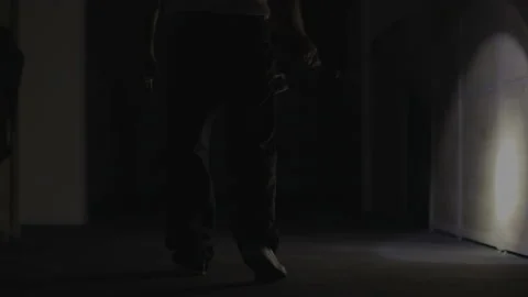 Security Guard makes a detour In Corridor Of The Building Using Flashlight. High Stock Footage 134843913