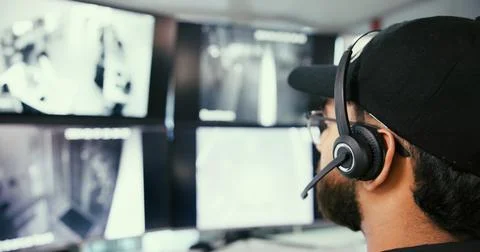 Security guard, man and computer in control room, headset for communication and Stock Photos