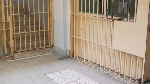 Security guard with metal bars in the prison. Video stock 120758803