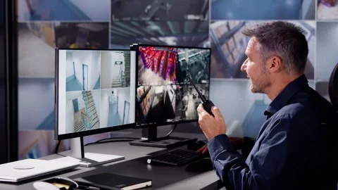 The Security Guard Monitors the CCTV System Stock Footage 257132514