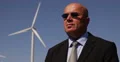 Security Guard One Man Guarding Wind Turbine Farm Power Plant Field Surveillance 4k or 4k+ Resolution