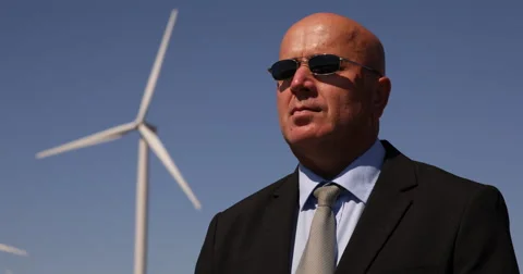 Security Guard One Man Guarding Wind Turbine Farm Power Plant Field Surveillance Stock Footage 54540181