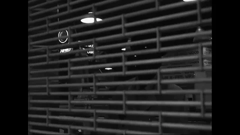 Security Guard Opens Market Roller Shutters 動画素材 126629943