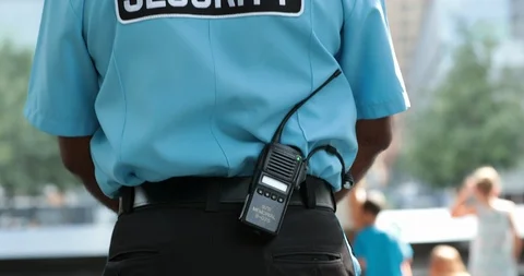 Security guard outside standing surveilling Stock Footage 119392895