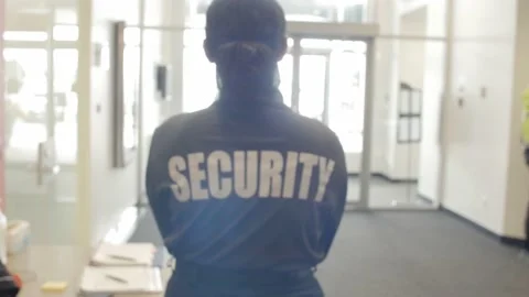 Security guard patrolling office space Stock Footage 237634228