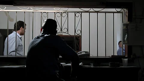 Security Guard at Prison Entrance Window with Iron Bars, Argentina - 4K Stock Footage 329732465