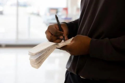 Security guard recording information to share 库存照片