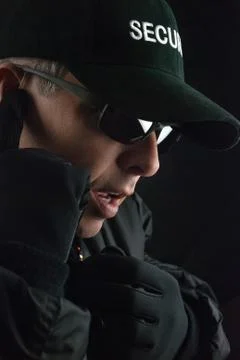 Security guard reports into microphone Stock Photos