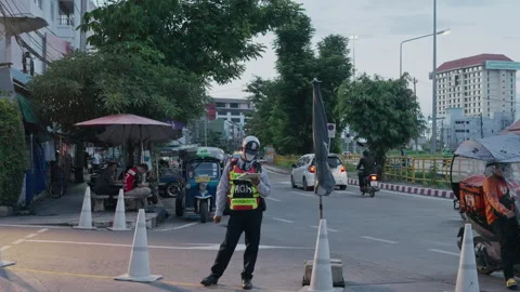 Security Guard Standing on Duty on City Street at Sunset 스톡 동영상 337534425