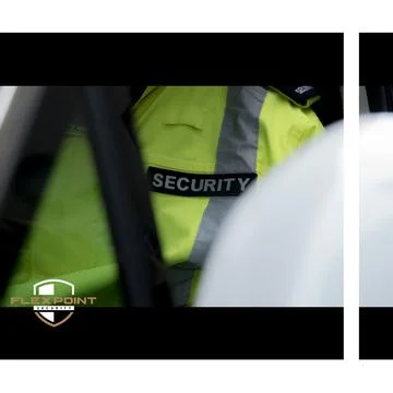 Security guard standing by next to security car Stock Photos