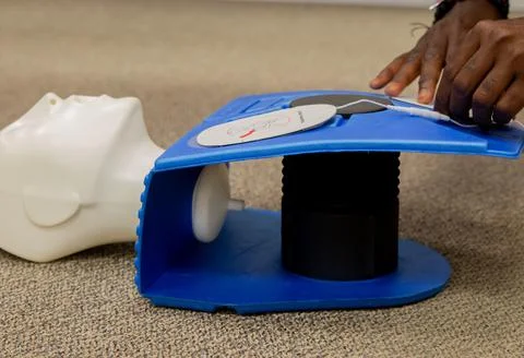 Security guard training for  CPR first aid with the AED. Stock Photos