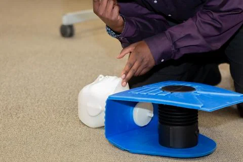 Security guard training for  CPR first aid with the AED. Stock Photos
