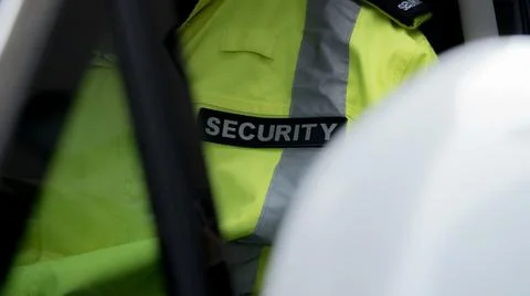 Security guard waiting inside security vehicle Stock Photos
