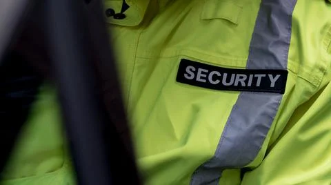 Security guard waiting inside security vehicle Stock Photos