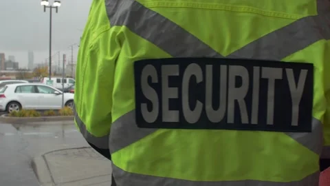 Security guard walking and patrolling street in city Stock Footage 153888544