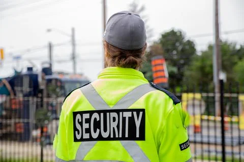 Security guard watching construction site on the street Stock Photos