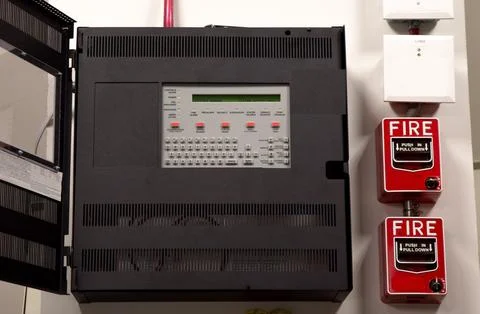 Security guards are learning how to use fire alarm panel Stock Photos