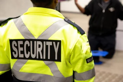 Security guards are learning how to use fire alarm panel Stock Photos
