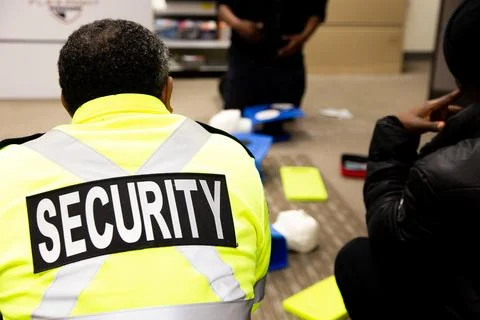 Security guards are learning how to use fire alarm panel Stock Photos