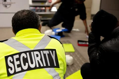 Security guards are learning how to use fire alarm panel Stockfoto's